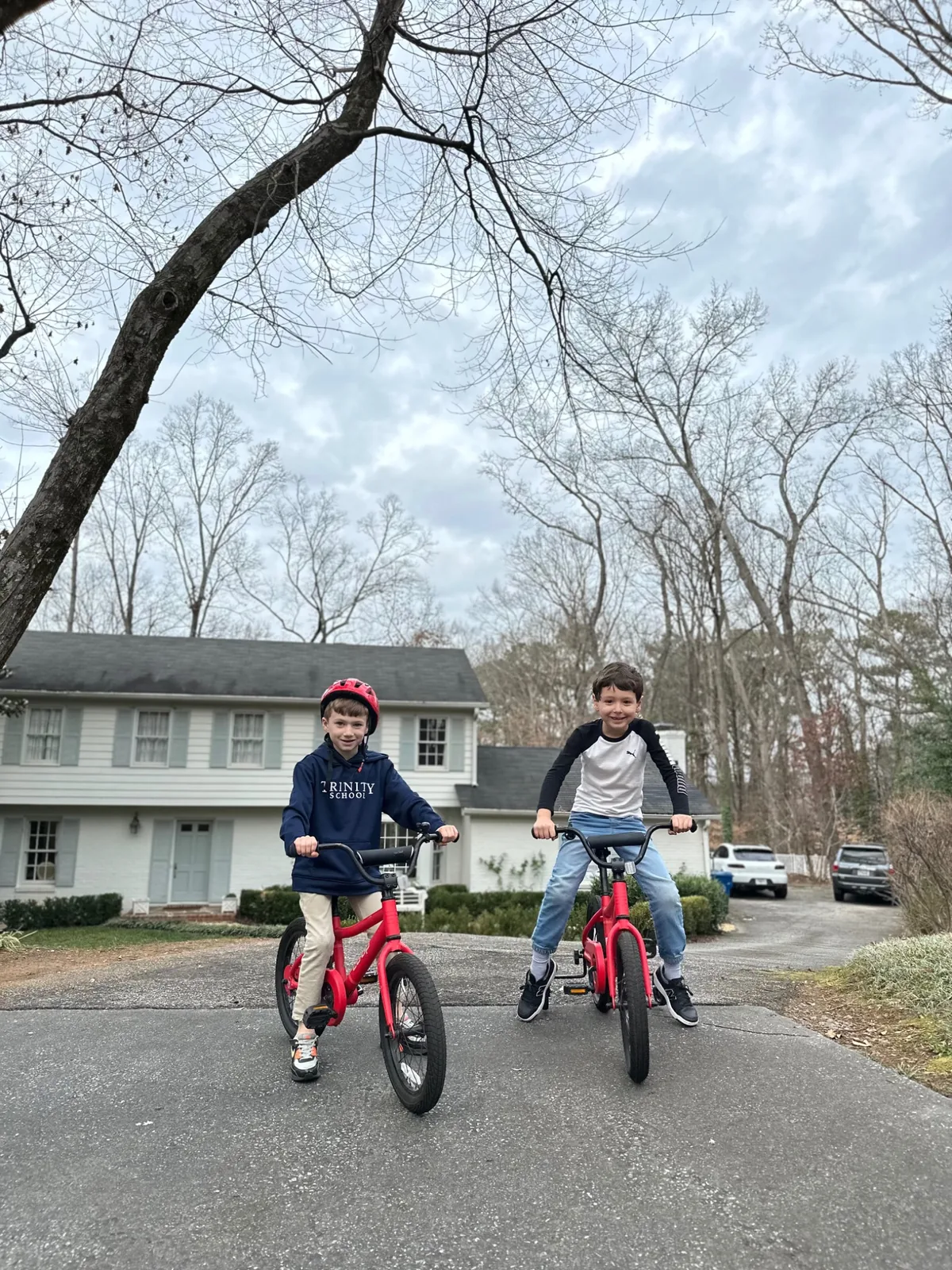 Leo and his brother on red bikes